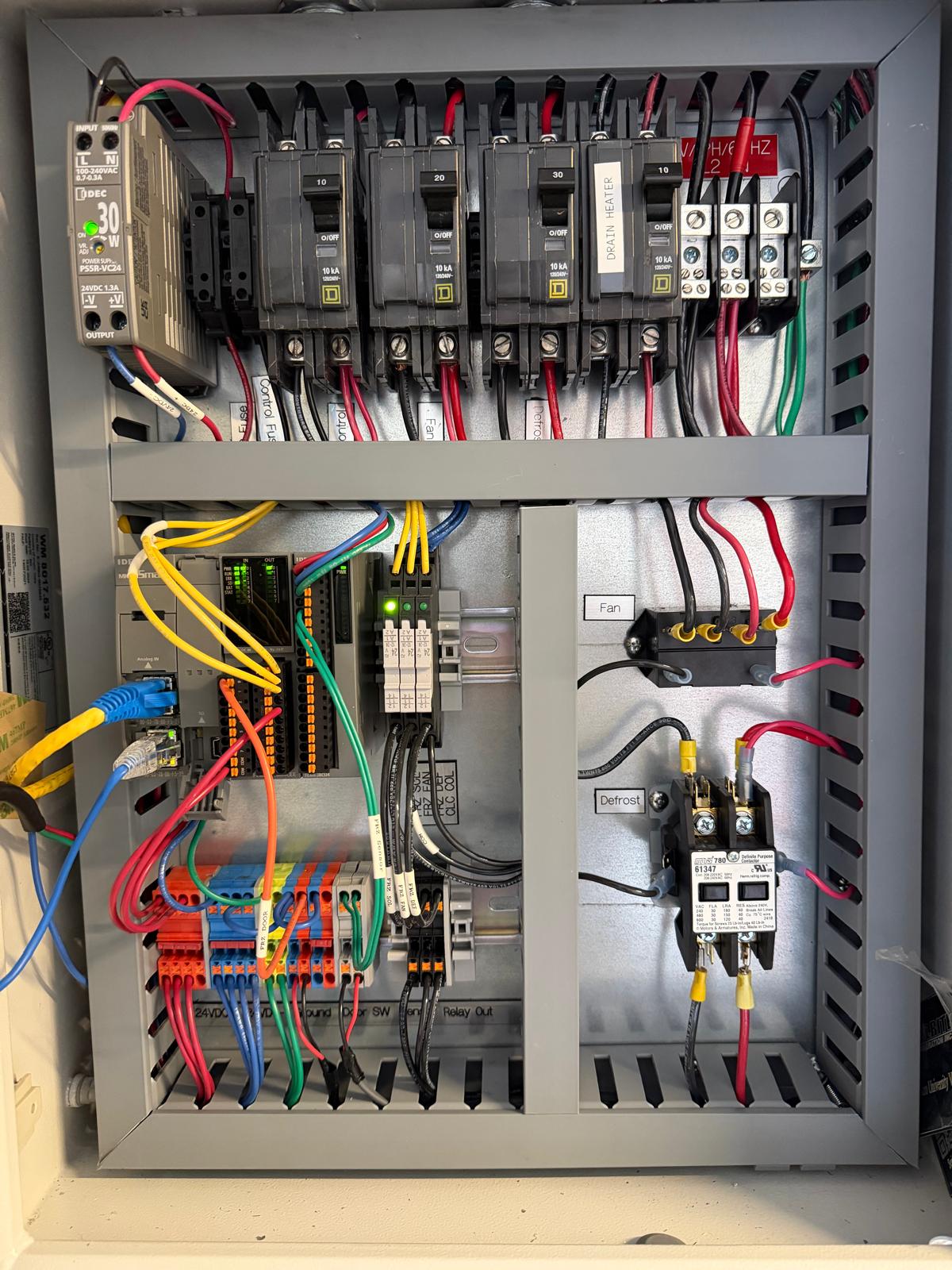 UL Certified Coolrite EMS control panel — custom 24VDC build with Siemens breakers, dedicated defrost and fan circuits, and clearly labeled terminals
