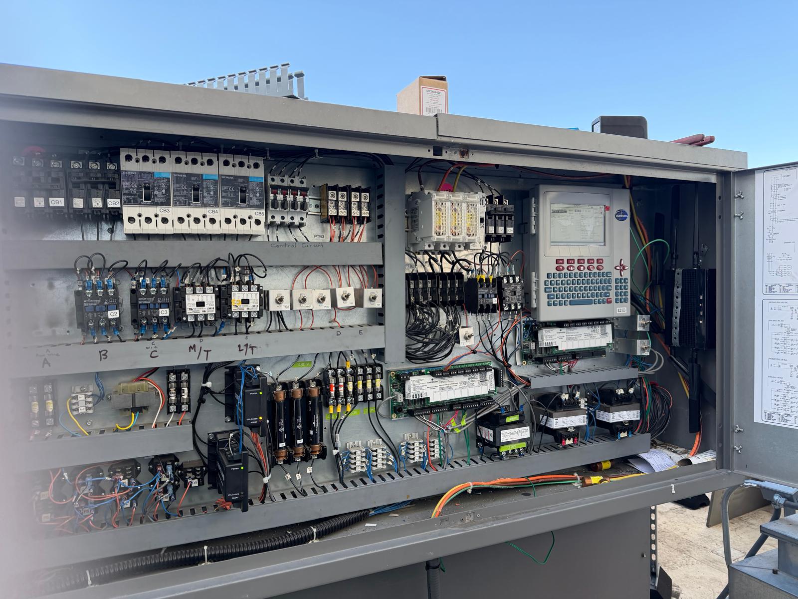 Rooftop Coolrite UL Certified EMS Panel with Siemens CB1-CB5 breakers and integrated touchscreen data logger on the door